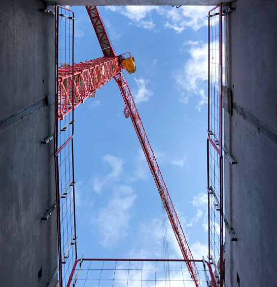 Jobsite lift shaft and tower crane